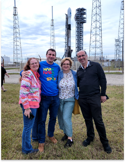 Left to right: Margo Young, Dominik Cieslak, Magdalena Kuzmicz-Cieslak, and Vanderlei Martins stand in front of the PACE spacecraft the day before its launch. 
    Photo credit: Margo Young