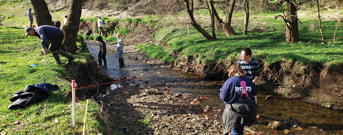 Students collect data that measure flow rate, depth, pebble size, and more as part of the “stream lab” in a popular, interdisciplinary GES course