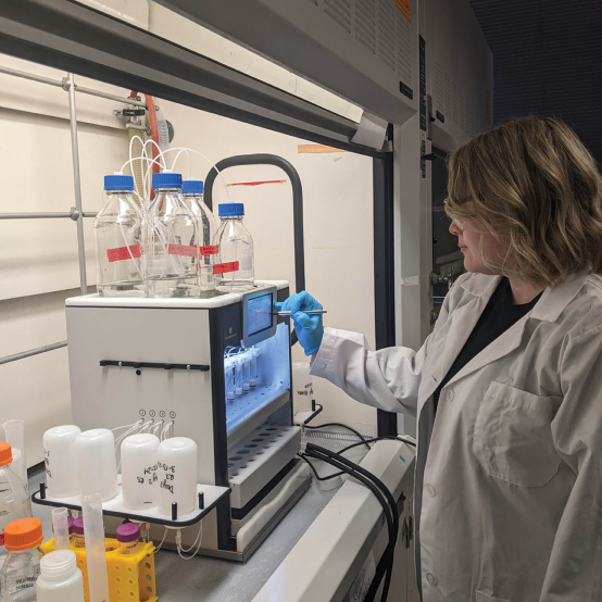 Amanda Belunis prepares samples for later  analysis in the Molecular Characterization and Analysis Complex. Photo by Catherine Meyers.