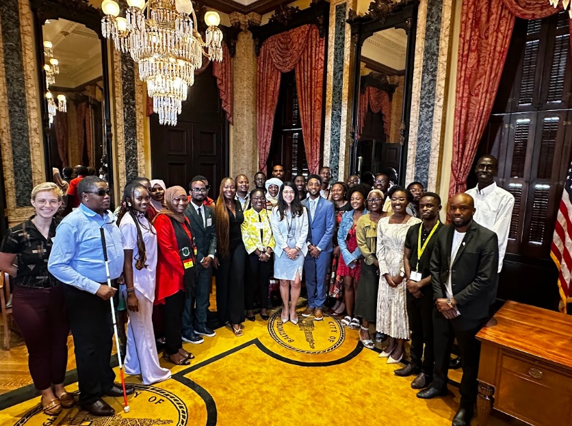 A large group of young African leaders gather at Baltimore City Hall