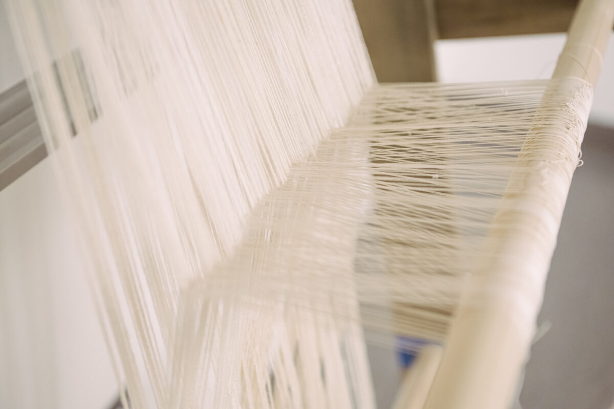 close-up of the threads on a loom