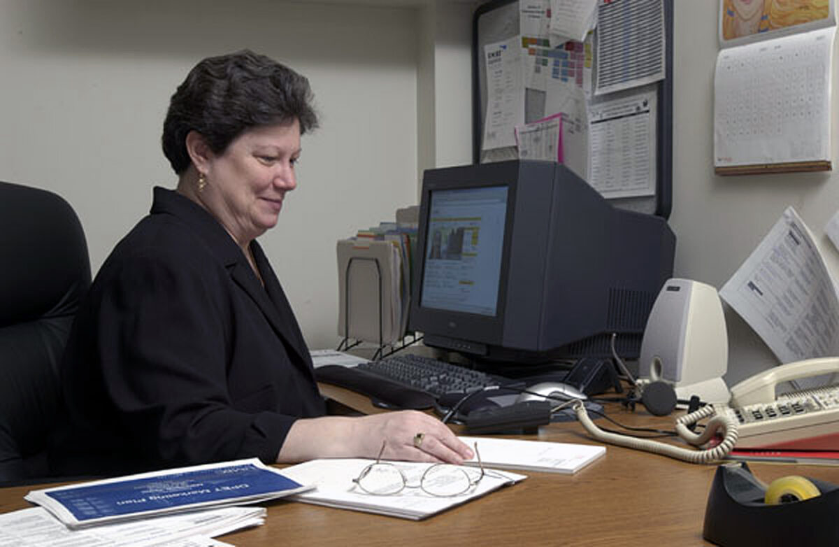 Hathaway poses on campus for a photoshoot to advertise the Masters of Science in Information Systems online program