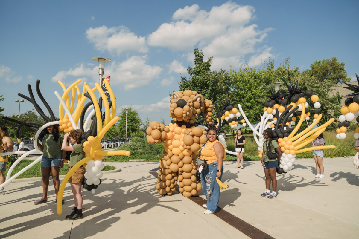 UMBC's mascot True Grit made out of balloons walks down the street