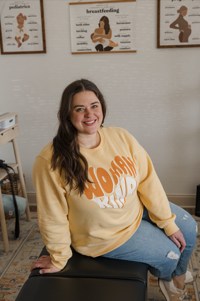 a woman lounges in a chiropractic office 