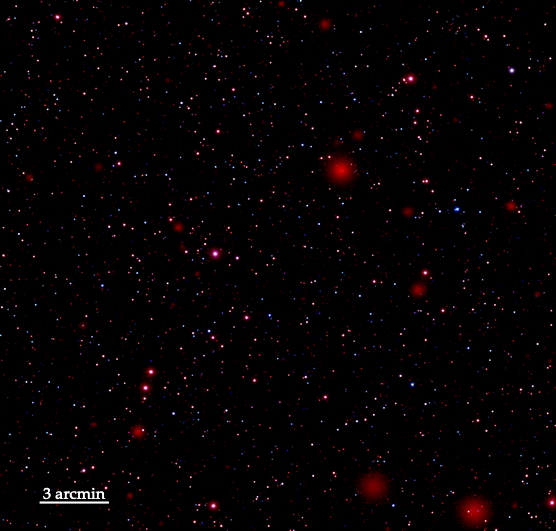 simulated telescope image; black background with a lot of blurry red dots of different sizes. Scale bar in lower left reads "3 arcmin."