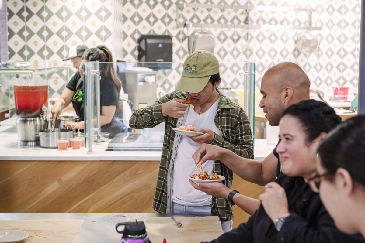 UMBC students taste fried Salvadoran meat pies at True Grit's Test Kitchen