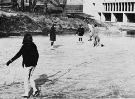 UMBC students ice skate on pond