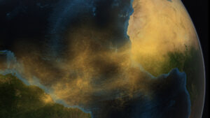 an image of Earth from space with Africa on the right, South America on the left, and a big cloud of tan dust aerosols traveling from one to the other