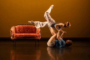 Dancers perform on stage.