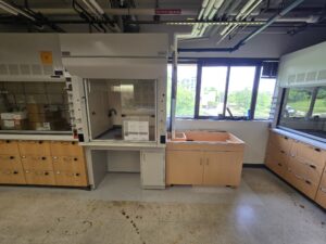laboratory under construction; a fume hood and lab bench at a lower height than the one next to it to be inclusive of students who use wheelchairs