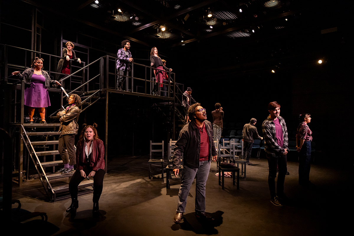 a diverse group of students performing on stage