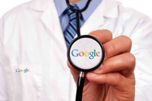 Man in lab coat with "Google" logo holds up a stethoscope, also reading "Google"