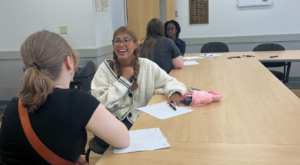 Adriana, Sherman Scholars Program, at a club meeting for Best Buddies. The members are introducing themselves to each other to see who fits together as a “buddy pair.”