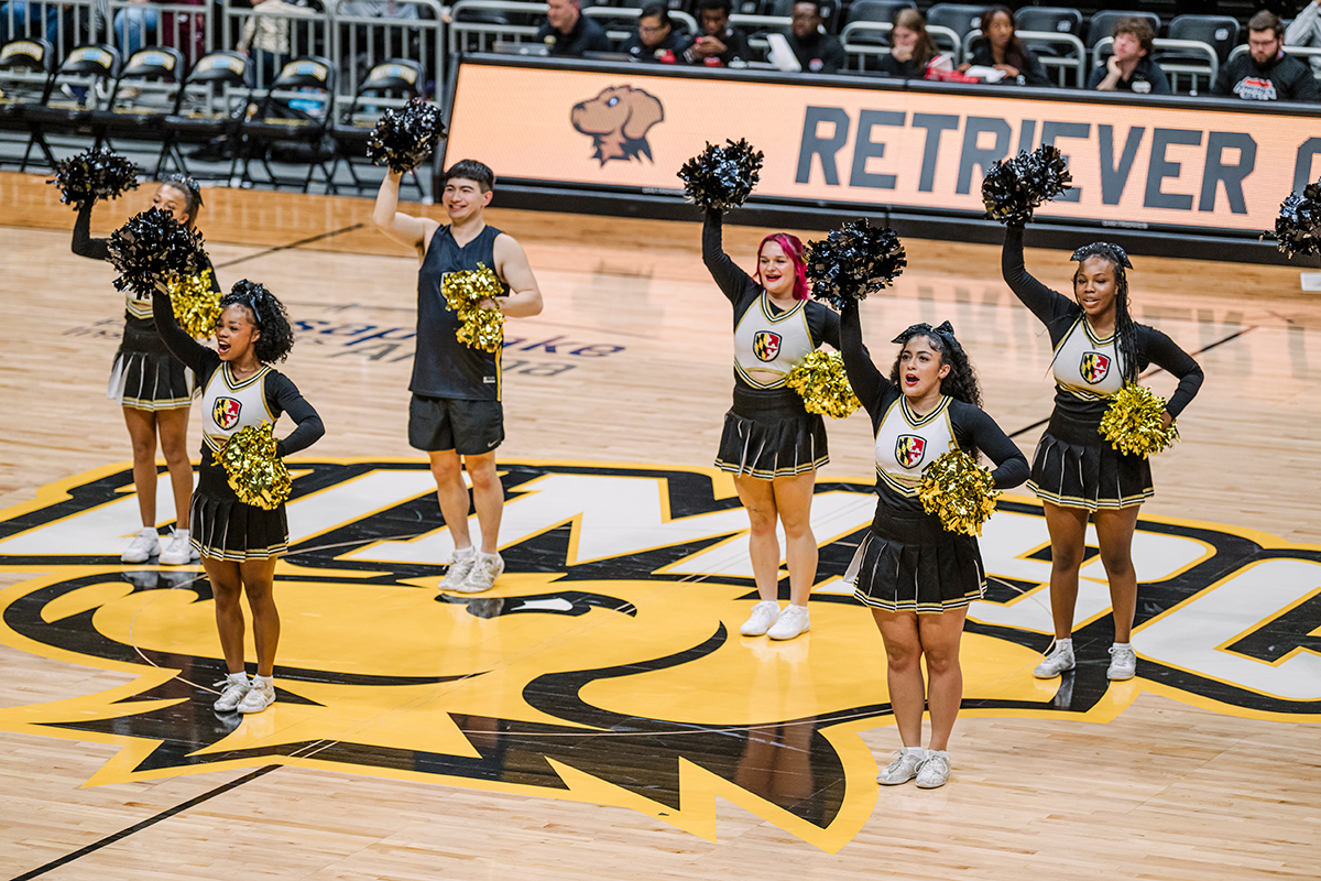 umbc cheerleaders at a retrievers basketball game