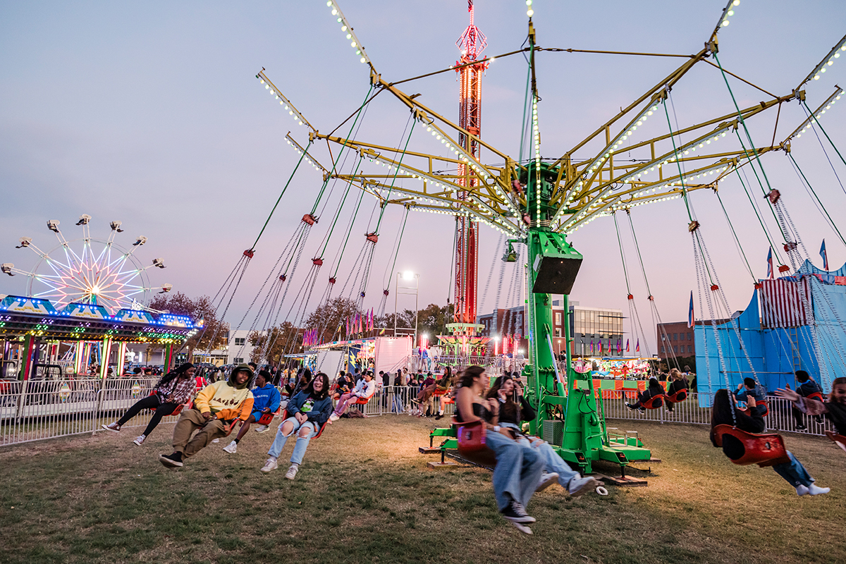 carnival night with colorful rides