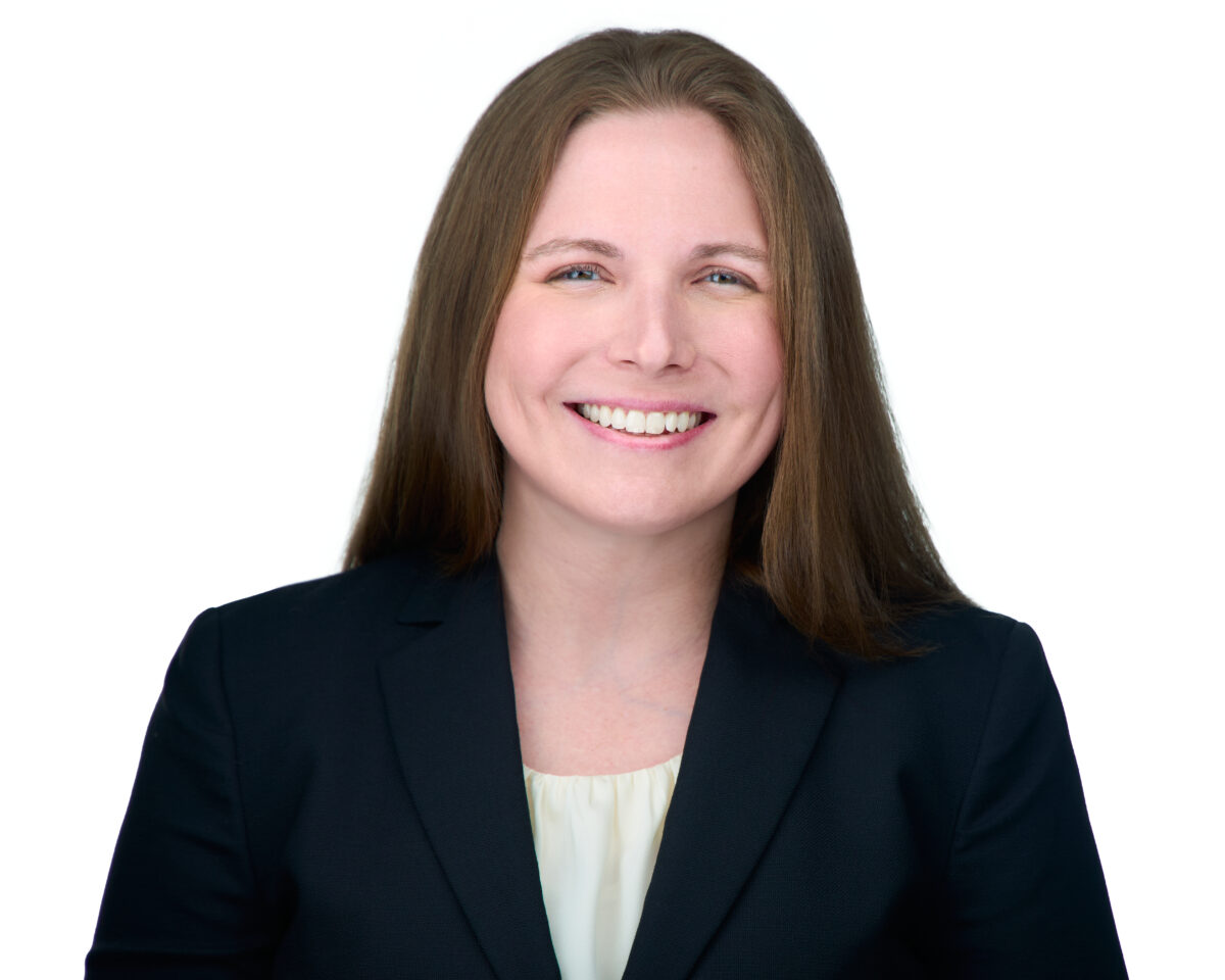 portrait of smiling woman in blazer