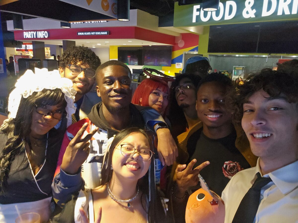group photo of friends at a food court