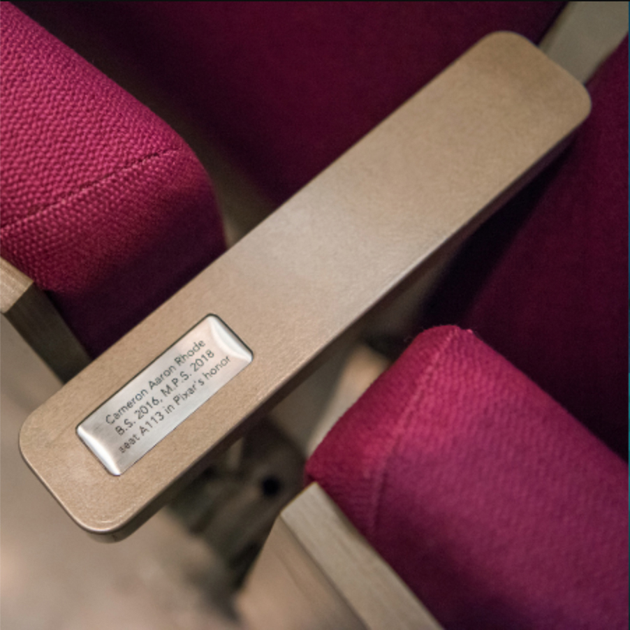 Seat arm rest reading Cameron Aaron Rhode B.S. 2016 M.P.S. 2018