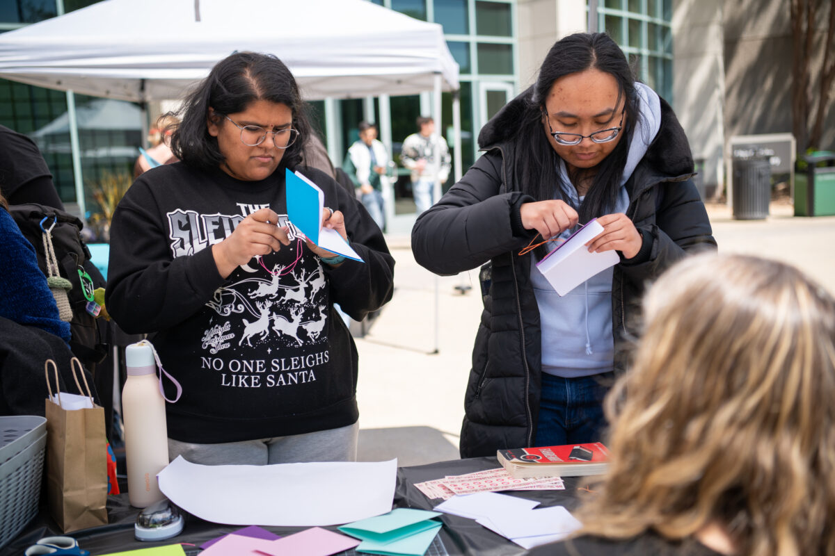 students stitch together their own books
