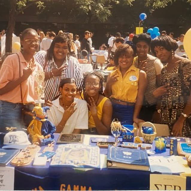 Marshall and several members of Sigma Gamma Rho tabling at an event on campus.