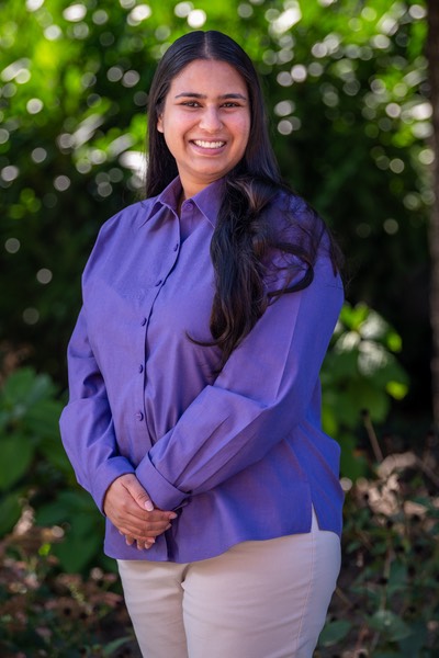 Headshot of a person smiling.