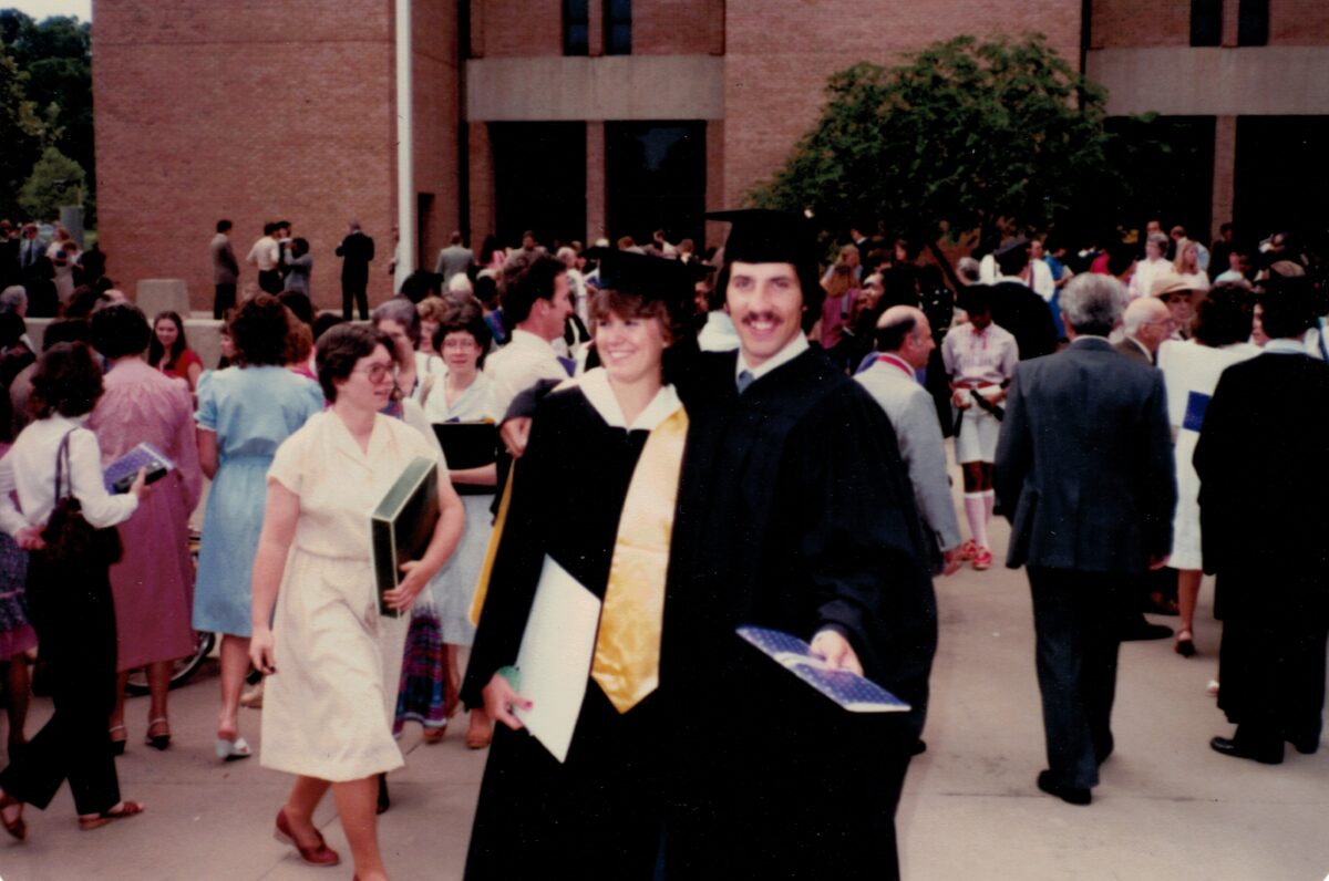 Pam Offutt and Jay Offutt in their caps and gowns after graduating from UMBC in 1982.