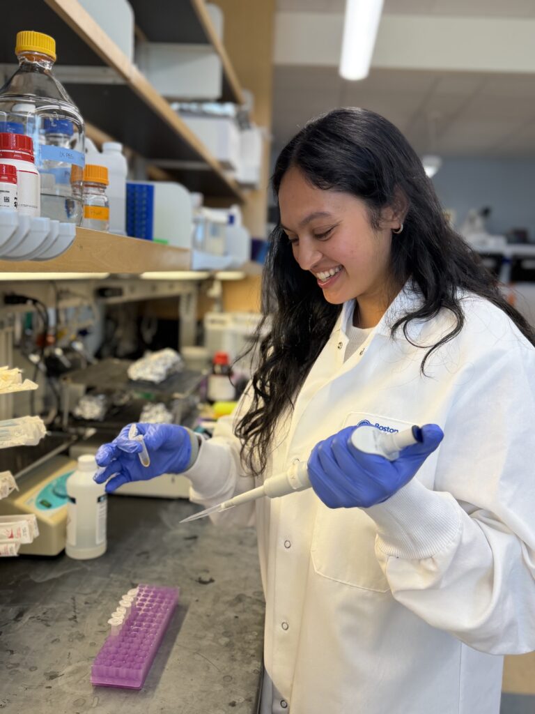 Cech Fellow Silvi Shah works a pipet at a lab bench
