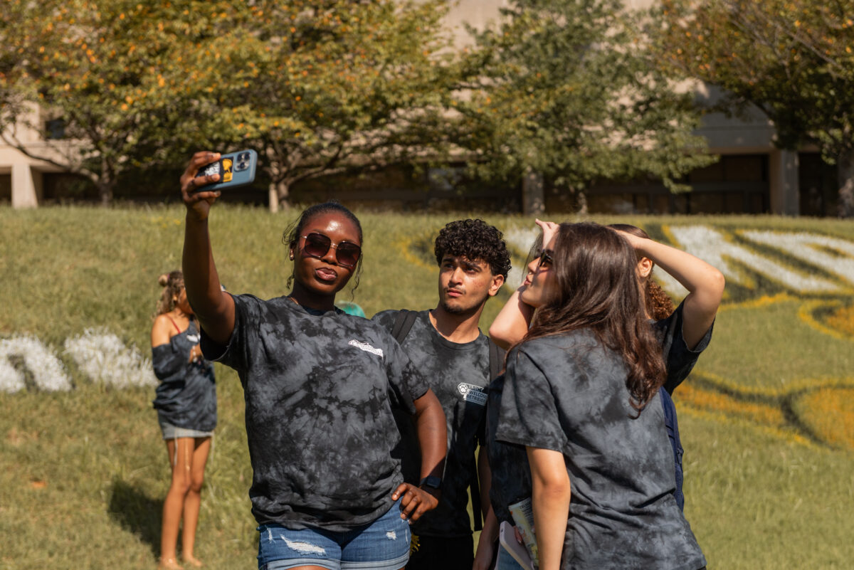 welcome, retrieve leaders gather on the lawn to take a selfie