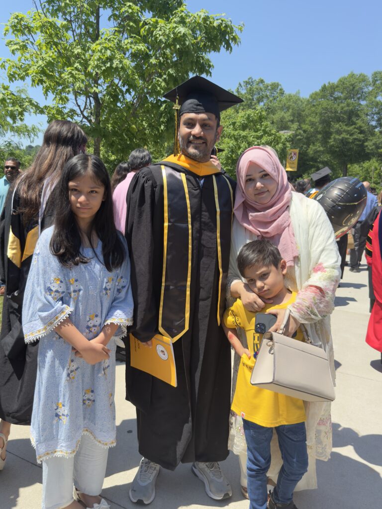 ASM Mobarak Hossain (middle) outside the Chesapeake Employers Insurance Arena following commencement with his daughter, Ayra (left), wife, Humayira (right), and son, Ayaz (bottom right).